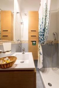 a bathroom with a sink and a shower at Appartment in Nea Erithrea in Athens