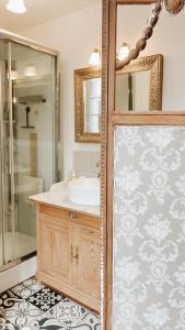 a bathroom with a sink and a shower at Ar Maen Gite et Chambres d'hotes in Lanvollon +35 photos
