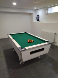 a pool table with balls on it in a room at Tamaris in Vukovar