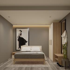 a bedroom with a bed and a picture of a woman at Split Rooftop Suites in Durrës