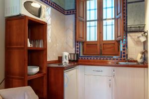 Kuchyňa alebo kuchynka v ubytovaní Charminghomesgranada Apartamento Fajalauza