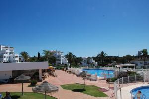 a view of a resort with a pool and buildings at Casa Elviria Del Sol in Marbella