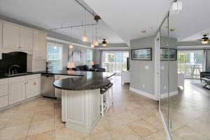 a kitchen with a island in the middle of a room at Dunes Club 2A by Pristine Properties Vacation Rentals in Cape San Blas