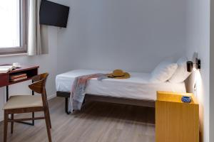 Postel nebo postele na pokoji v ubytování RoccaRegina Hotel