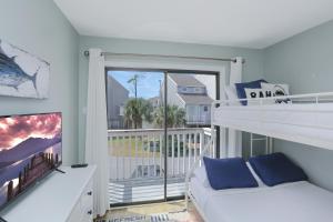 Voodi või voodid majutusasutuse Barrier Dunes 164 - 144 Bay Breeze by Pristine Properties Vacation Rentals toas