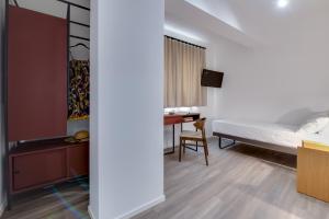 Postel nebo postele na pokoji v ubytování RoccaRegina Hotel