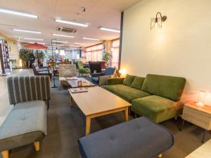 Χώρος καθιστικού στο Omotenashi Hostel Miyajima