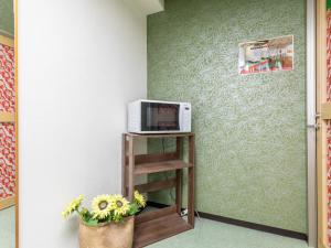 Μια τηλεόραση ή/και κέντρο ψυχαγωγίας στο Omotenashi Hostel Miyajima
