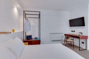 Postel nebo postele na pokoji v ubytování RoccaRegina Hotel
