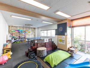 Χώρος καθιστικού στο Omotenashi Hostel Miyajima