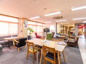 Χώρος καθιστικού στο Omotenashi Hostel Miyajima
