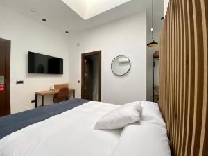 Postel nebo postele na pokoji v ubytování Evenia Alcalá Boutique Hotel + 37 fotografií