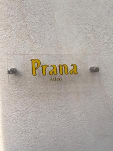 a sign on a wall with the name of a company at ALYANA in Córdoba