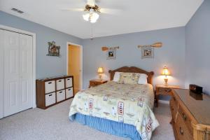 a bedroom with a bed and two night stands and two lamps at DeLight House by Pristine Properties Vacation Rentals in Indian Pass