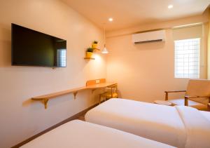 Una cama o camas en una habitación de Bloom Hotel - HSR Layout Sector 3