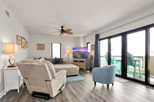 a living room with a couch and a chair at Club at Mexico Beach 2E by Pristine Properties Vacation Rentals in Mexico Beach