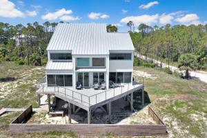 a house sitting on top of a beach at Indian Summer in Indian Pass