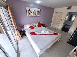Postel nebo postele na pokoji v ubytování Sea Boss Homestay