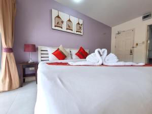 Postel nebo postele na pokoji v ubytování Sea Boss Homestay