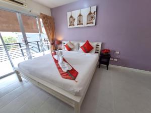 Postel nebo postele na pokoji v ubytování Sea Boss Homestay