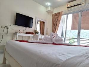 Postel nebo postele na pokoji v ubytování Sea Boss Homestay