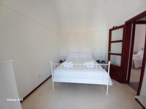 Postel nebo postele na pokoji v ubytování LA CASA DI CARINA