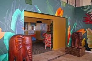 a room with a entrance to a room with a exhibit at 305 Guest House in Amanzimtoti