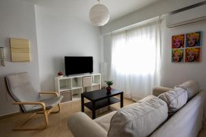 Televízia a/alebo spoločenská miestnosť v ubytovaní FUN BUILDING FLATS by HOMEABOUT