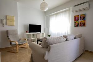 Televízia a/alebo spoločenská miestnosť v ubytovaní FUN BUILDING FLATS by HOMEABOUT