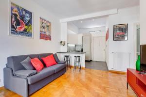 a living room with a couch and a table at AM House Colosseo in Rome