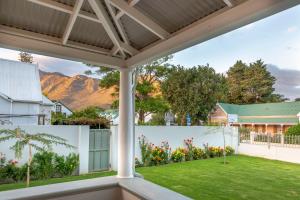a view from the porch of a house with a yard at Monte Vista Boutique Hotel in Montagu