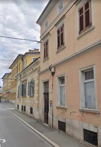a row of buildings on the side of a street at Pula Antic Rooms in Center in Pula