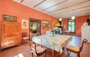 a dining room with a table and chairs at Roseto Immacolata in Roccastrada