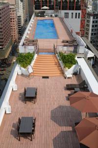 a swimming pool on the roof of a building at Prudential Hotel in Hong Kong