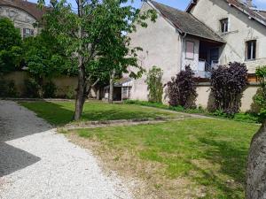 a house with a tree in the yard at VILLA Douce Loue in Ornans +7 photos