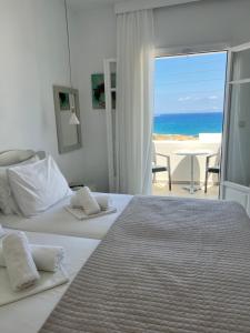 A bed or beds in a room at Vavanos Studios