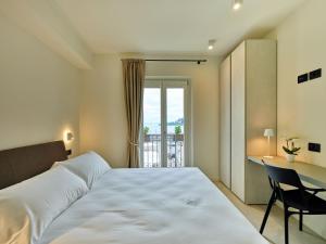 Katil atau katil-katil dalam bilik di Piccolo Hotel
