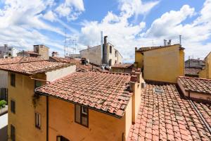 a view of roofs of buildings in a city at Santa Croce Top by Mmega in Florence