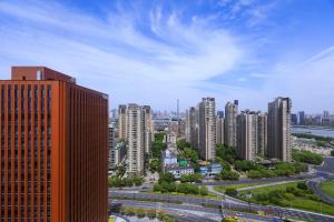 a view of a city with tall buildings at Warm Four Bedroom Apartment with Huangpu River View in Shanghai