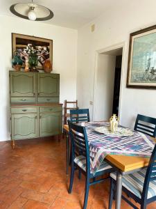 a dining room with a table and chairs at 'Il Casale di Giova' Tuscan Farmhouse in Lucca