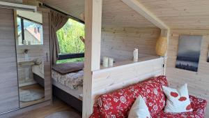 Postel nebo postele na pokoji v ubytování Sauerland-Tinyworld - Ihr Tiny Ferienhaus im Sauerland am Diemelsee