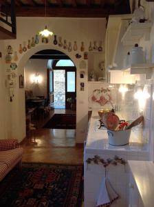a kitchen with an archway in a room at B&B Michelangeli - Private parking in Orvieto
