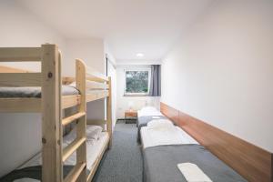 Krevet ili kreveti na kat u jedinici u objektu Hotel pod Wieliczką