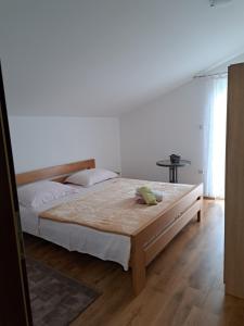 Postel nebo postele na pokoji v ubytování Apartman Ema 2