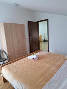 Postel nebo postele na pokoji v ubytování Apartman Ema 2