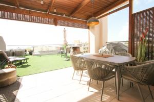 Posezení v ubytování Ático en el centro con terraza