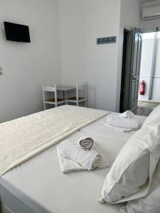 A bed or beds in a room at Vavanos Studios
