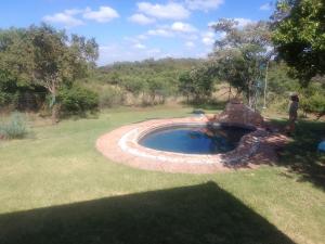 a small pool of water in a yard at Matalatala Wildlife Lodge in Roodeplaat
