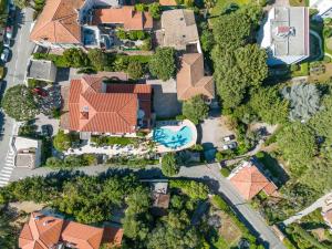 an overhead view of a house with a swimming pool at Hôtel Beau Site - Cap d'Antibes in Antibes