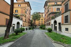 an empty street in a city with buildings at Residenza Sacconi in Rome